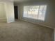 Spacious living room with neutral wall paint and carpet at 1864 Cindy Dr, Decatur, GA 30032