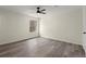 Bedroom with modern flooring, natural light from window, and neutral paint at 3753 Adamsville Sw Dr, Atlanta, GA 30331