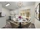 Dining area with a modern chandelier and sliding glass door to the screened in porch at 3753 Adamsville Sw Dr, Atlanta, GA 30331
