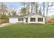 Charming single-story home with a well-maintained lawn and a one car garage at 3753 Adamsville Sw Dr, Atlanta, GA 30331