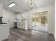 Eat-in kitchen with white cabinets, stainless steel appliances, and sliding doors to porch at 3753 Adamsville Sw Dr, Atlanta, GA 30331