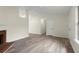 Bright living room featuring wood-look floors and a fireplace at 3753 Adamsville Sw Dr, Atlanta, GA 30331