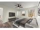 Cozy main bedroom featuring a ceiling fan, large window and ample natural light at 3753 Adamsville Sw Dr, Atlanta, GA 30331
