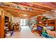 Unfinished basement with exposed ductwork, shelving, and a walkout to the backyard at 4380 Serenity Lake Dr, Cumming, GA 30028