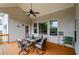 View from the deck showing an outdoor dining table and seating overlooking a green lawn at 4380 Serenity Lake Dr, Cumming, GA 30028