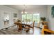 Bright dining room with hardwood floors, large windows and views of the porch at 4380 Serenity Lake Dr, Cumming, GA 30028