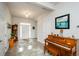 Elegant entryway with hardwood floors, piano, and an antique grandfather clock at 4380 Serenity Lake Dr, Cumming, GA 30028