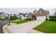 Brick front exterior of a two-story home with a well-manicured lawn and a two car garage at 4380 Serenity Lake Dr, Cumming, GA 30028