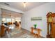 Bright foyer featuring hardwood floors, a classic grandfather clock, and doorway leading to the main living area at 4380 Serenity Lake Dr, Cumming, GA 30028