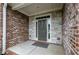 Inviting brick entryway with a stylish front door and stone accents at 4380 Serenity Lake Dr, Cumming, GA 30028
