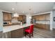 Modern kitchen featuring stainless steel appliances, a center island and stylish pendant lighting at 4380 Serenity Lake Dr, Cumming, GA 30028