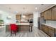 Modern kitchen with stainless steel appliances, an island with a granite countertop, and hardwood floors at 4380 Serenity Lake Dr, Cumming, GA 30028