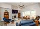 Beautiful living room with a stone fireplace, vaulted ceiling and large windows that provide ample natural light at 4380 Serenity Lake Dr, Cumming, GA 30028