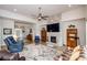 This living room has a stunning stone fireplace, vaulted ceilings, and an open layout for easy entertaining at 4380 Serenity Lake Dr, Cumming, GA 30028