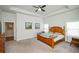 Serene main bedroom with natural light, neutral walls, carpeted floors, and a spacious layout at 4380 Serenity Lake Dr, Cumming, GA 30028
