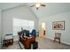 Bright office with a large window, vaulted ceilings, and an executive desk at 4380 Serenity Lake Dr, Cumming, GA 30028