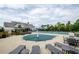 Inviting community pool area with lounge chairs, covered tables, and a nearby clubhouse for social gatherings at 4380 Serenity Lake Dr, Cumming, GA 30028