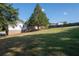 Spacious backyard, offering privacy and a large grassy area at 1022 Washington Ave, Woodstock, GA 30188