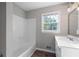 Clean bathroom with white vanity and shower/tub combo at 1022 Washington Ave, Woodstock, GA 30188