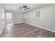 Bright bedroom featuring wood-look floors and ceiling fan at 1022 Washington Ave, Woodstock, GA 30188