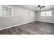 Spacious bedroom with new flooring and multiple windows at 1022 Washington Ave, Woodstock, GA 30188