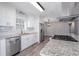 Bright kitchen, white cabinets, granite counters, stainless steel appliances at 1022 Washington Ave, Woodstock, GA 30188