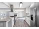 Modern kitchen with granite countertops and stainless steel appliances at 1022 Washington Ave, Woodstock, GA 30188