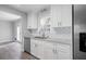 White kitchen with granite countertops and stainless steel dishwasher at 1022 Washington Ave, Woodstock, GA 30188
