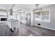 Modern kitchen with island, stainless steel appliances, and white cabinets at 1022 Washington Ave, Woodstock, GA 30188