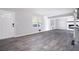 Spacious living room with grey wood-look floors and lots of natural light at 1022 Washington Ave, Woodstock, GA 30188