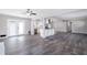 Open living area with wood-look floors and kitchen views at 1022 Washington Ave, Woodstock, GA 30188
