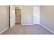 Carpeted bedroom with closet space and neutral walls at 3500 Quinn Ridge Dr, Snellville, GA 30039