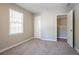 Neutral bedroom featuring a window for natural light and a closet for storage at 3500 Quinn Ridge Dr, Snellville, GA 30039