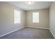 Bright bedroom with neutral walls, plush carpet, and a large window at 3500 Quinn Ridge Dr, Snellville, GA 30039