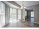 Dining area with lots of natural light from the sliding glass doors leading to outdoor deck at 3500 Quinn Ridge Dr, Snellville, GA 30039
