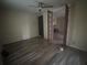 View of open living room featuring wood floors, fireplace and ceiling fan at 602 W Lake Nw Ave, Atlanta, GA 30318