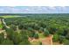 Aerial view showing home and surrounding land at 915 Rocky Creek Rd, Hampton, GA 30228