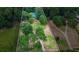 Aerial view of house, yard, and driveway at 915 Rocky Creek Rd, Hampton, GA 30228