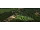 Aerial view of property showing house and large wooded lot at 915 Rocky Creek Rd, Hampton, GA 30228