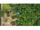 House nestled in a wooded area with a long driveway at 915 Rocky Creek Rd, Hampton, GA 30228