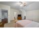 Bright bedroom with hardwood floors, ceiling fan, and ample closet space at 915 Rocky Creek Rd, Hampton, GA 30228