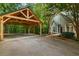 Large wooden carport next to a house at 915 Rocky Creek Rd, Hampton, GA 30228