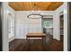 Dining room features wood floors and a chandelier at 915 Rocky Creek Rd, Hampton, GA 30228