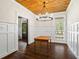 Formal dining room with wood floors, wainscoting, and a chandelier at 915 Rocky Creek Rd, Hampton, GA 30228