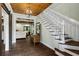 Elegant entryway with hardwood floors and a stunning staircase at 915 Rocky Creek Rd, Hampton, GA 30228