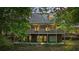Two-story home with a large deck and a detached garage at 915 Rocky Creek Rd, Hampton, GA 30228