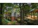 Two story home with a deck nestled in the woods at 915 Rocky Creek Rd, Hampton, GA 30228