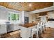 Modern kitchen features white cabinets, a butcher block island, and stainless steel appliances at 915 Rocky Creek Rd, Hampton, GA 30228