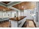 Open concept kitchen boasts a large butcher block island and white cabinetry at 915 Rocky Creek Rd, Hampton, GA 30228