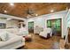 Bright living room featuring hardwood floors and a cozy seating area at 915 Rocky Creek Rd, Hampton, GA 30228